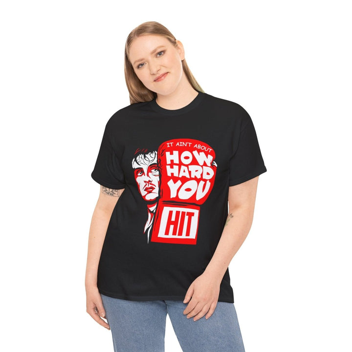 Inspirational Unisex Heavy Cotton Tee - "It Ain't About How Hard You Hit" - Black - S - Inspirational Unisex Heavy Cotton Tee - "It Ain't About How Hard You Hit" - Tatoo Tee