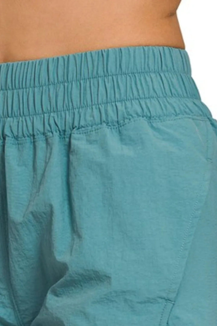 Zenana Windbreaker Smocked Waistband Running Shorts - DUSTY TEAL - S - fcd266eb - 5cb4 - 4bff - 965e - 01befbc9183c - Max - Origin - Tatoo Tee